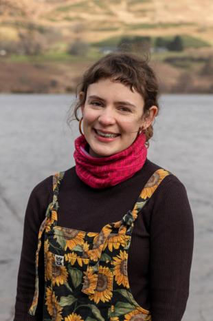 photo of Hannah Mitchell with loch and mountains in background