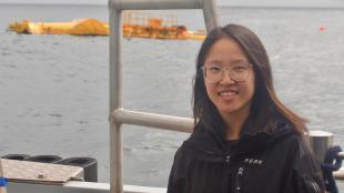 Nian Liu at sea, with wave power device in background