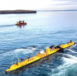 Orbital O2 floating tidal turbine at sea with support vessel nearby
